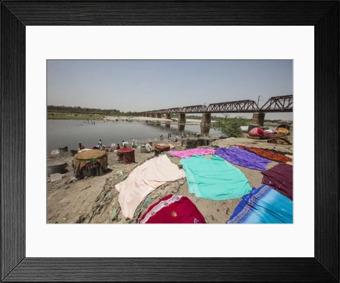 Framed Print : Colorful clothes drying in the sun on the banks of the River Yamuna, a polluted tributary Framed Print : Colorful clothes drying in the sun on the banks of the River Yamuna, a polluted tributary