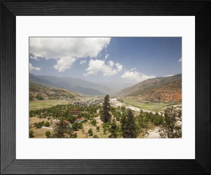 Framed Print : The Paro valley extends westward closer to the peaks that rise on the Tibetan border Framed Print : The Paro valley extends westward closer to the peaks that rise on the Tibetan border