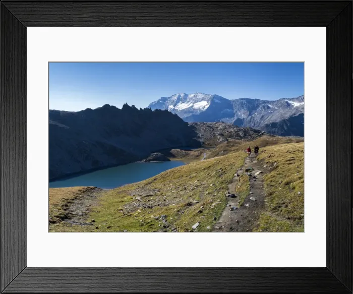 Framed Print : Hikers walking on the Colle del Nivolet beside Rossett Lake (Lago Rossett), Gran Framed Print : Hikers walking on the Colle del Nivolet beside Rossett Lake (Lago Rossett), Gran