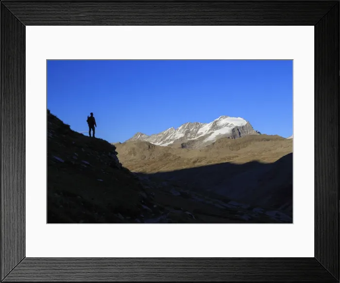 Framed Print : Hiker admires the view of Alpi Graie (Graian Alps) landscape, Gran Paradiso National Park Framed Print : Hiker admires the view of Alpi Graie (Graian Alps) landscape, Gran Paradiso National Park