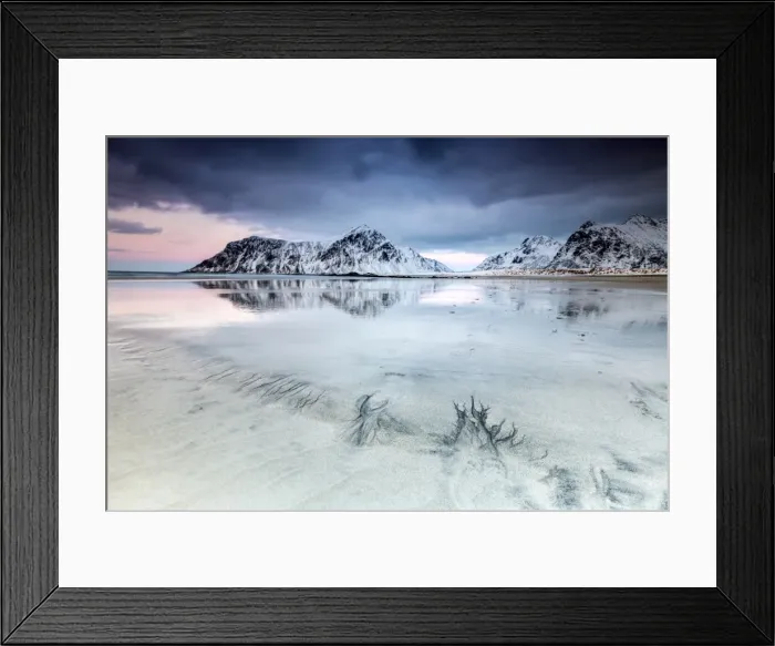 Framed Print : Sunset on Skagsanden beach surrounded by snow covered mountains reflected in the cold sea Framed Print : Sunset on Skagsanden beach surrounded by snow covered mountains reflected in the cold sea