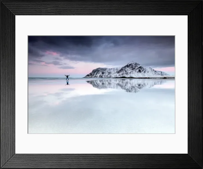 Framed Print : Sunset and hiker on Skagsanden beach surrounded by snow covered mountains, Flakstad Framed Print : Sunset and hiker on Skagsanden beach surrounded by snow covered mountains, Flakstad