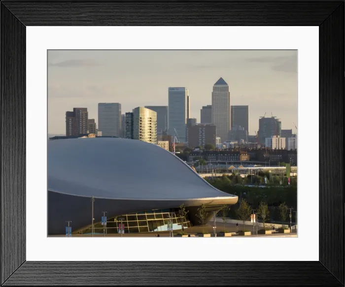 Framed Print : Olympic Park Aquatic Centre with Docklands and Canary Wharf skyline behind, London Framed Print : Olympic Park Aquatic Centre with Docklands and Canary Wharf skyline behind, London