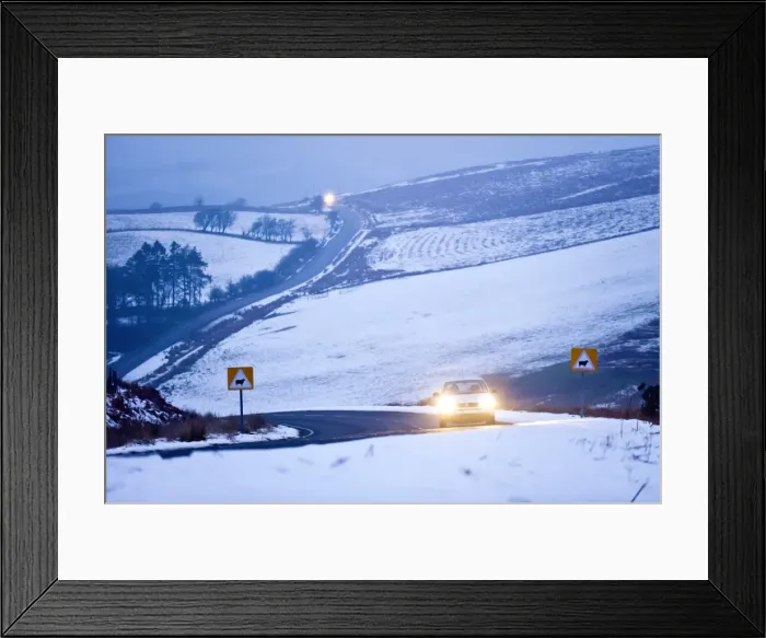 Framed Print : A motorist drives through a wintry landscape on the B4520, Brecon Road, on the Mynydd Framed Print : A motorist drives through a wintry landscape on the B4520, Brecon Road, on the Mynydd