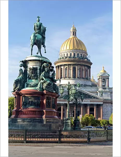 Golden dome of St. Isaacs Cathedral built in 1818 and the equestrian statue of Tsar