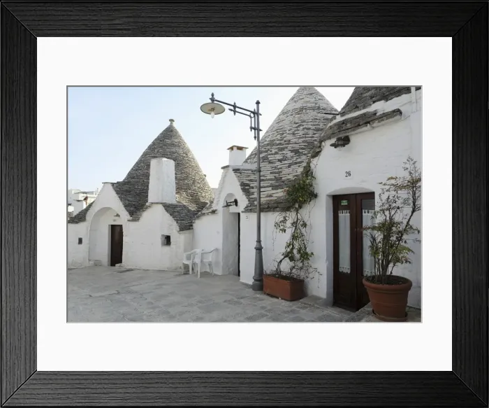 Framed Print : Cone-shaped trulli houses, in the Rione Monte district of Alberobello, UNESCO World Heritage Site Framed Print : Cone-shaped trulli houses, in the Rione Monte district of Alberobello, UNESCO World Heritage Site