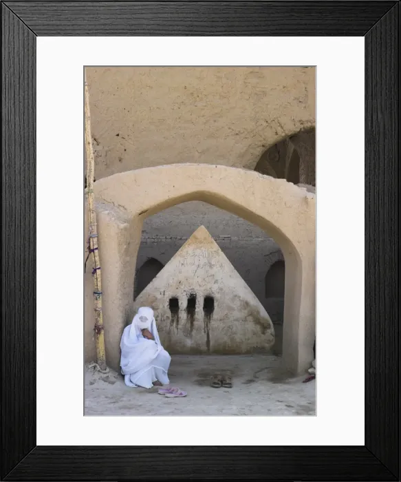 Framed Print : Lady visiting a possible early 8th Century tomb of a 19th century AD saint behind mosque for blesssing for childbirth  /  sickness, No-Gonbad Mosque also known as Khoja Piada or Masjid-e Haji Piyada, Balkh, Balkh province, Afghanistan, Iraq
