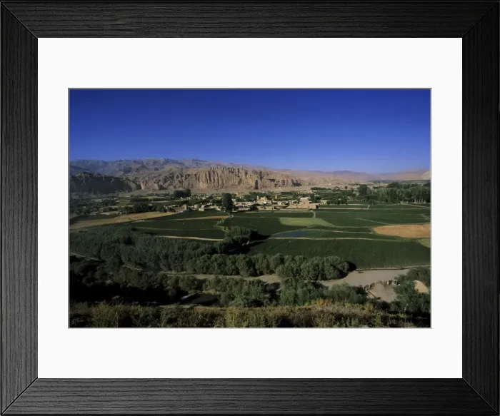 Framed Print : View of Bamiyan showing cliffs with two empty niches where the famous carved Buddhas stood Framed Print : View of Bamiyan showing cliffs with two empty niches where the famous carved Buddhas stood