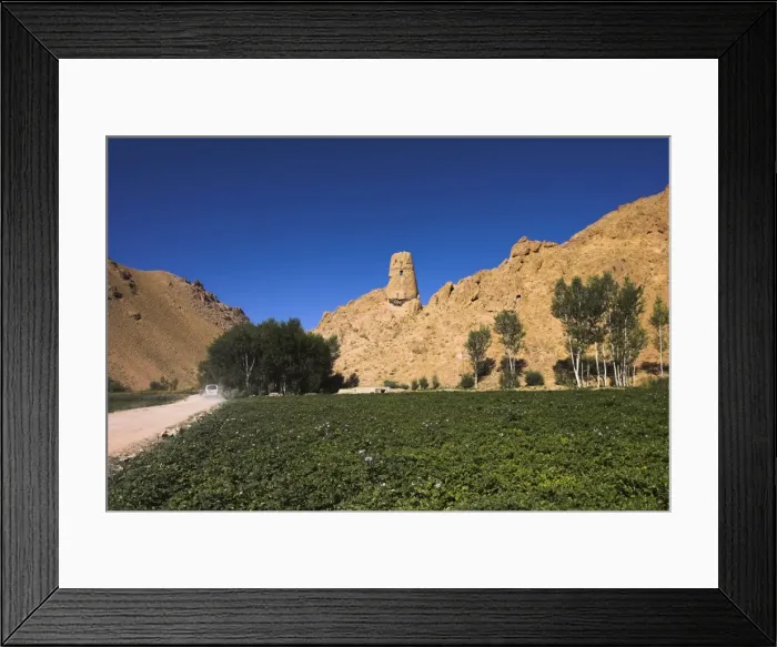 Framed Print : Watchtower at ruins which were once the site of a tall standing Buddha in a niche Framed Print : Watchtower at ruins which were once the site of a tall standing Buddha in a niche