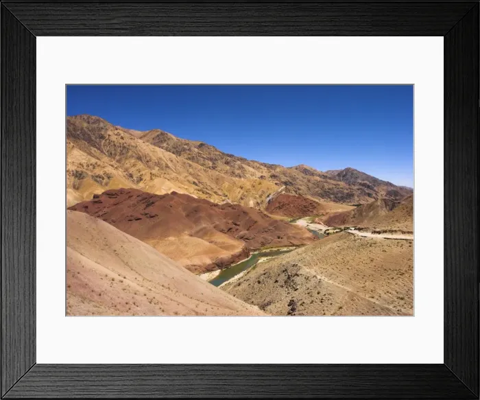 Framed Print : Hari Rud river flows through fertile valley at base of red rock mountains Framed Print : Hari Rud river flows through fertile valley at base of red rock mountains