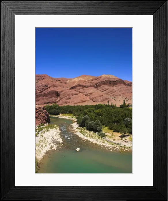 Framed Print : Hari Rud river flows through fertile valley at base of red rock mountains Framed Print : Hari Rud river flows through fertile valley at base of red rock mountains