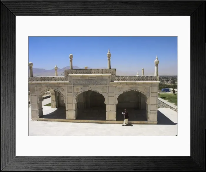 Framed Print : Man reading the Koran whilst walking round the white marble Mosque built by Shah Jahan Framed Print : Man reading the Koran whilst walking round the white marble Mosque built by Shah Jahan