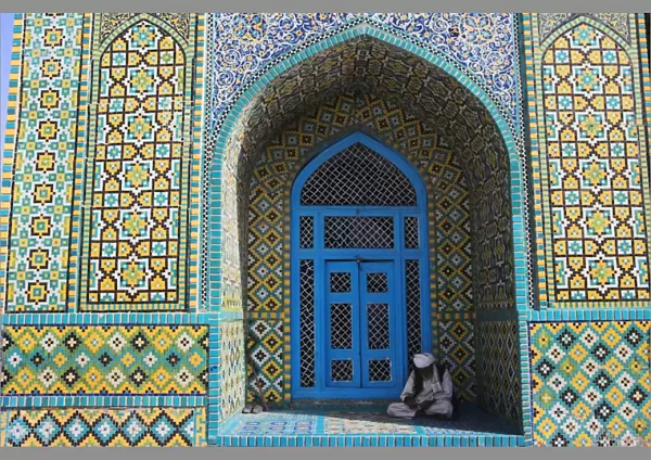 Pilgrim sits in a niche at the Shrine of Hazrat Ali, who was assassinated in 661
