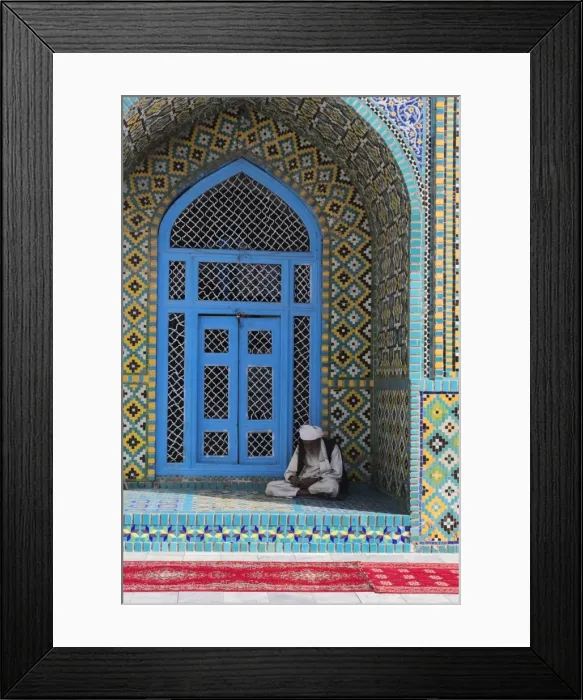 Framed Print : Pilgrim sits in a niche at the Shrine of Hazrat Ali, who was assassinated in 661 Framed Print : Pilgrim sits in a niche at the Shrine of Hazrat Ali, who was assassinated in 661