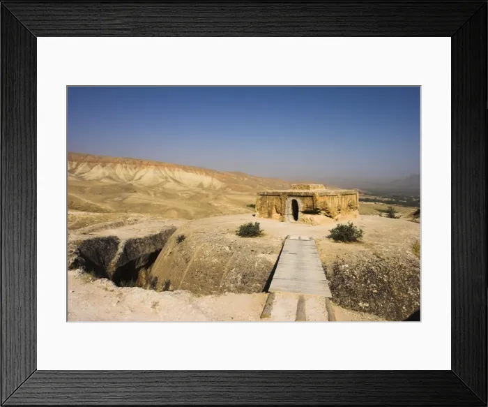 Framed Print : Wooden bridge across chasm leading to Buddhist stupa carved out of rock Framed Print : Wooden bridge across chasm leading to Buddhist stupa carved out of rock