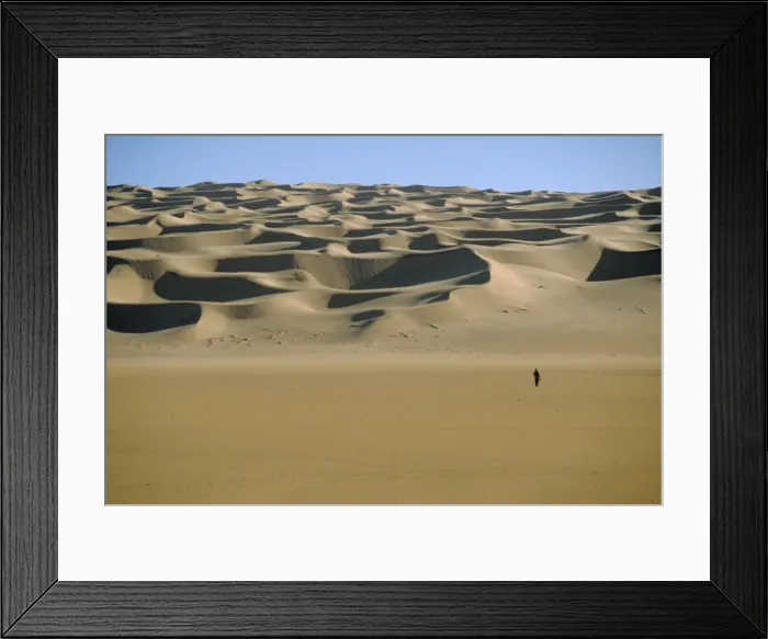 Framed Print : Sahara Desert with lone figure in foreground, Amguid, Algeria, Africa Framed Print : Sahara Desert with lone figure in foreground, Amguid, Algeria, Africa