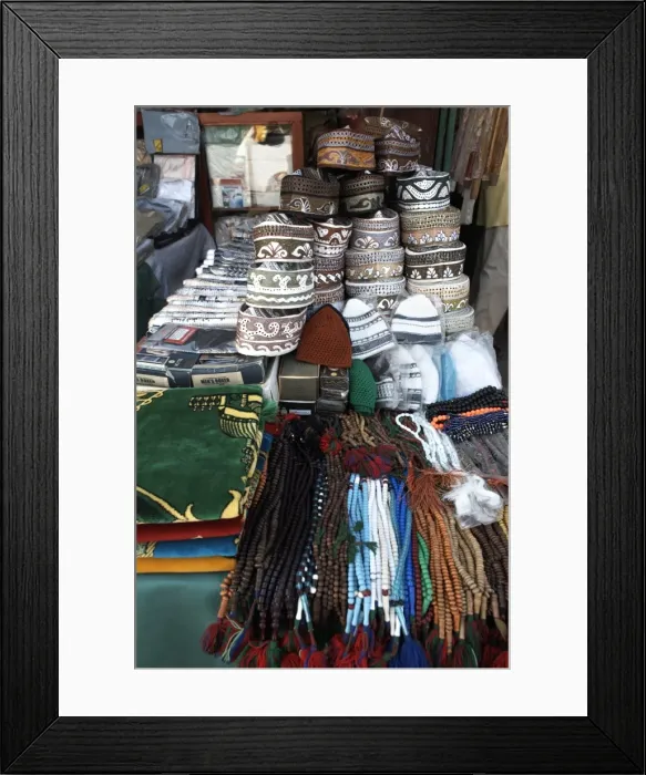 Framed Print : Islamic items including prayer mats and Muslim caps on sale at the market in the European Quarter of Djibouti City Framed Print : Islamic items including prayer mats and Muslim caps on sale at the market in the European Quarter of Djibouti City