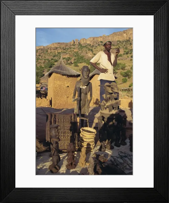 Framed Print : Man selling Dogon souvenirs, Mali, Africa Framed Print : Man selling Dogon souvenirs, Mali, Africa