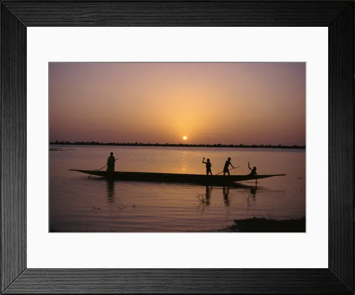 Framed Print : Children on local pirogue or canoe on the Bani River at sunset at Sofara, Mali, Africa Framed Print : Children on local pirogue or canoe on the Bani River at sunset at Sofara, Mali, Africa