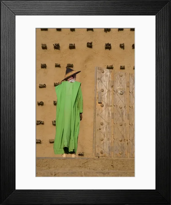 Framed Print : Man standing outside the Djenne Mosque, the largest mud structure in the world Framed Print : Man standing outside the Djenne Mosque, the largest mud structure in the world
