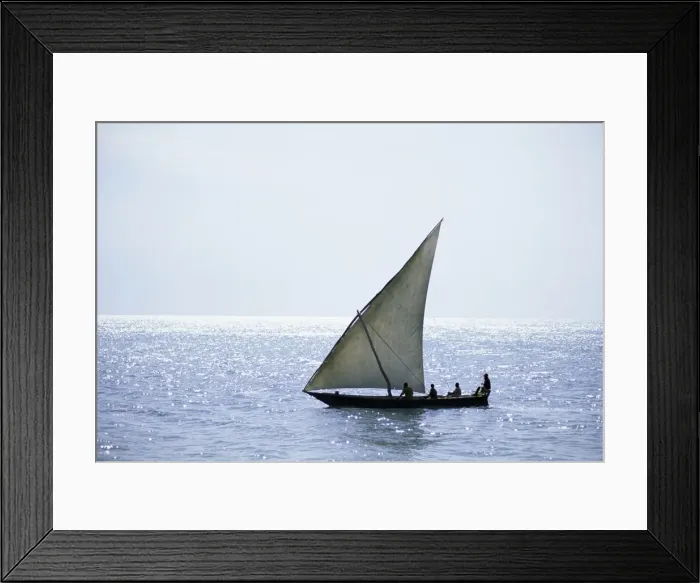 Framed Print : Dhow in silhouette on the Indian Ocean, off Stone Town, Zanzibar, Tanzania
