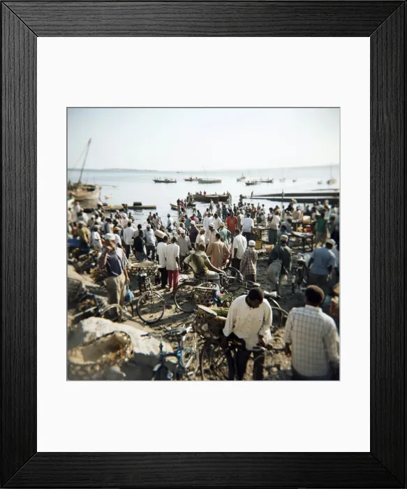 Framed Print : People waiting on beach for dhows to land fish, Stone Town, Zanzibar, Tanzania Framed Print : People waiting on beach for dhows to land fish, Stone Town, Zanzibar, Tanzania