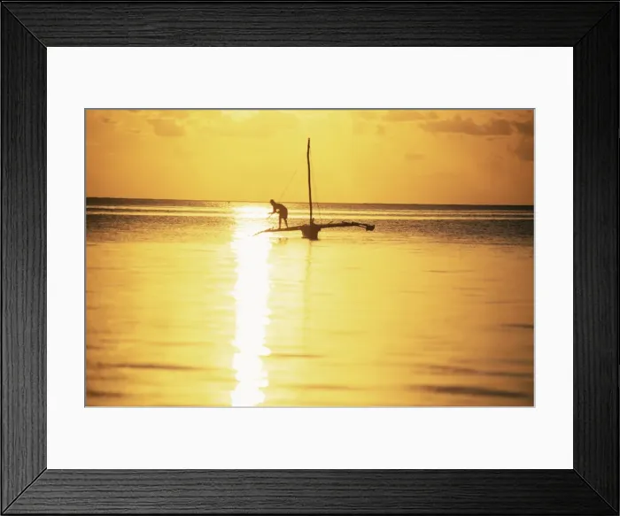 Framed Print : Outrigger canoe and fisherman in silhouette at sunrise off Jambiani, Zanzibar Framed Print : Outrigger canoe and fisherman in silhouette at sunrise off Jambiani, Zanzibar