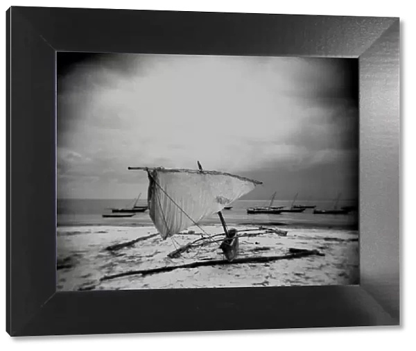 Image taken with a Holga medium format 120 film toy camera of dhow on beach in stormy weather