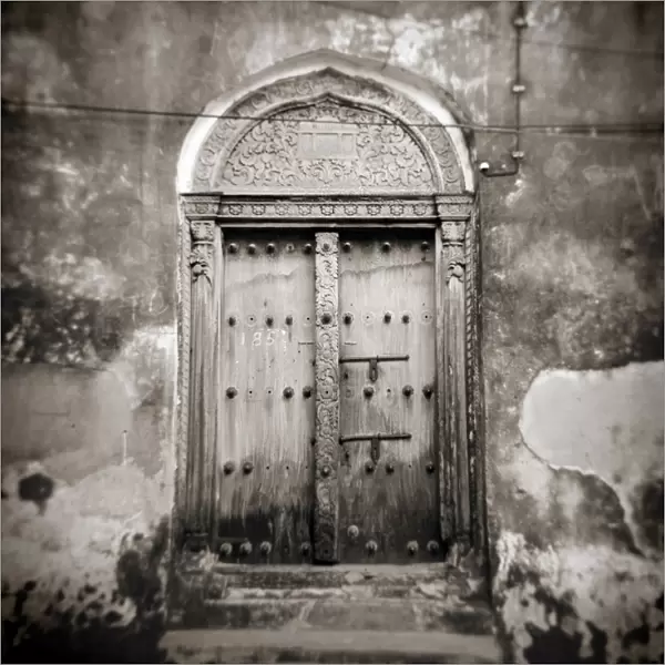 Image taken with a Holga medium format 120 film toy camera of old Omani studded timber door