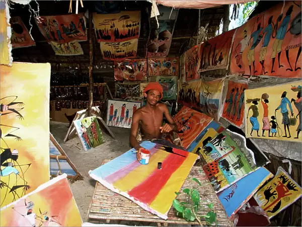 Local artist with his Tingatinga paintings, Zanzibar, Tanzania, East Africa, Africa