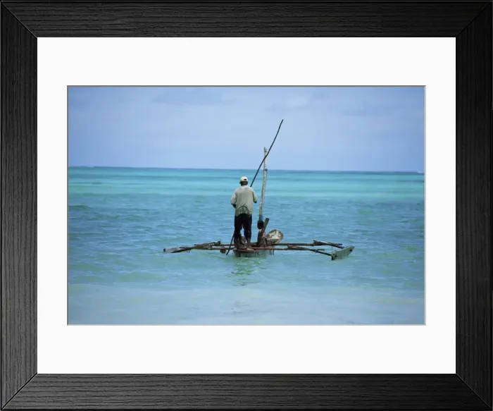 Framed Print : Man sailing a fishing boat on the Indian Ocean, Zanzibar, Tanzania, East Africa, Africa Framed Print : Man sailing a fishing boat on the Indian Ocean, Zanzibar, Tanzania, East Africa, Africa