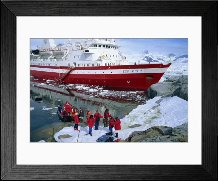 Framed Print : Passengers take small boat to the Explorer cruise ship anchored close inshore Framed Print : Passengers take small boat to the Explorer cruise ship anchored close inshore