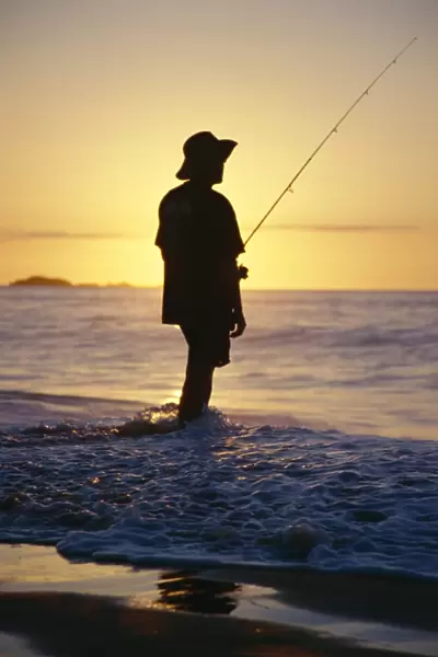 Fishing from the beach at sunrise, Australia, Pacific