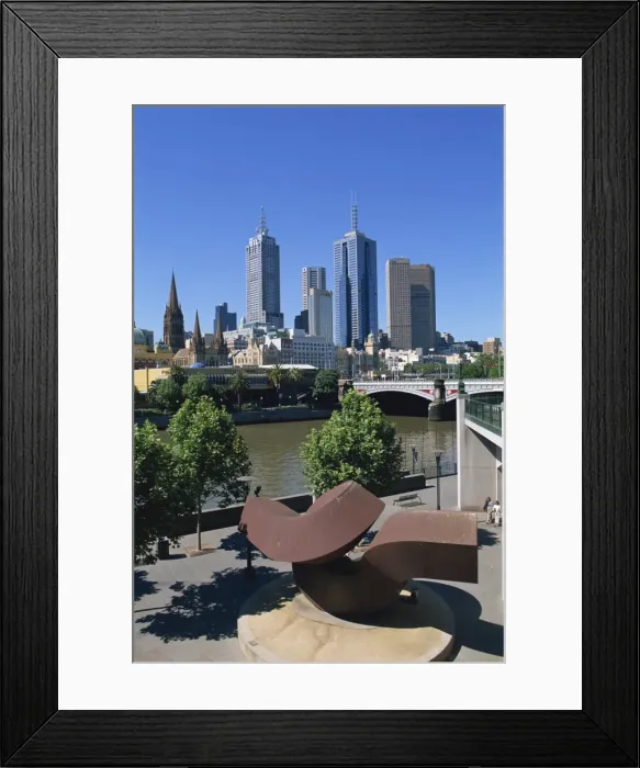 Framed Print : Sculpture on Yarra River embankment and city skyline, Melbourne, Victoria Framed Print : Sculpture on Yarra River embankment and city skyline, Melbourne, Victoria