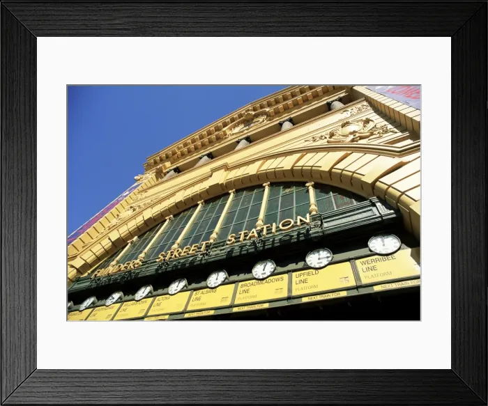 Framed Print : Facade of front of Flinders Street station with clocks showing department of next train Framed Print : Facade of front of Flinders Street station with clocks showing department of next train
