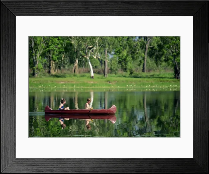 Framed Print : Children canoeing in Annaburroo Billabong at Mary River Crossing near the Arnhem Highway Framed Print : Children canoeing in Annaburroo Billabong at Mary River Crossing near the Arnhem Highway