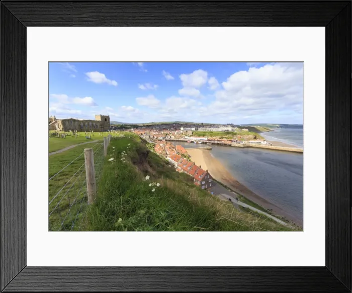 Framed Print : St. Marys Church and churchyard with view across Tate Hill Beach and town houses to West Cliff Framed Print : St. Marys Church and churchyard with view across Tate Hill Beach and town houses to West Cliff