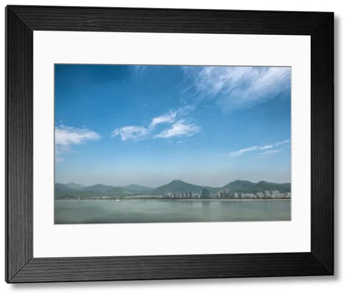Framed Print : Qiantang River, hills and high rises of Hangzhou, Zhejiang, China, Asia Framed Print : Qiantang River, hills and high rises of Hangzhou, Zhejiang, China, Asia
