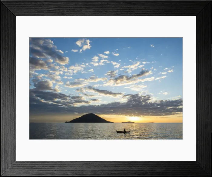 Framed Print : Silhouette of a man in a little fishing boat at sunset, Cape Malcear, Lake Malawi Framed Print : Silhouette of a man in a little fishing boat at sunset, Cape Malcear, Lake Malawi