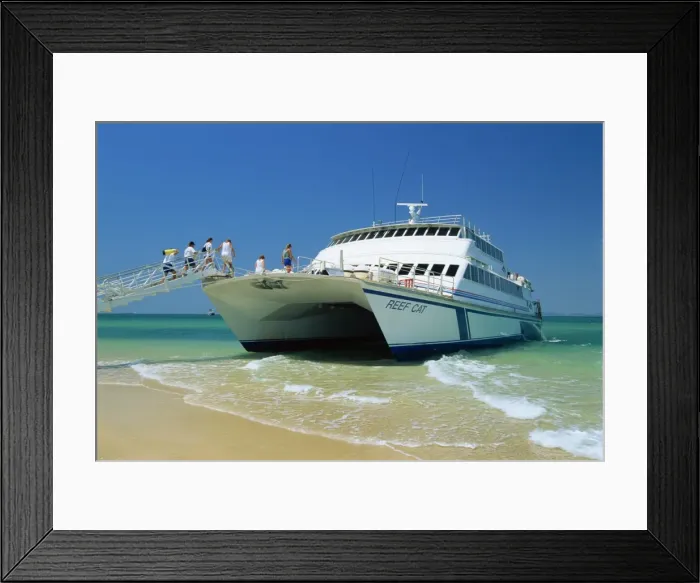 Framed Print : Tourists boarding large catamaran on beach near Rockhampton, Queensland Framed Print : Tourists boarding large catamaran on beach near Rockhampton, Queensland