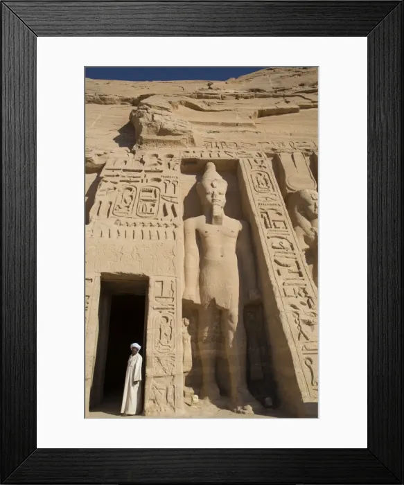 Framed Print : Local man at temple entrance, Ramses II statue on right, Hathor Temple of Queen Nefertari Framed Print : Local man at temple entrance, Ramses II statue on right, Hathor Temple of Queen Nefertari
