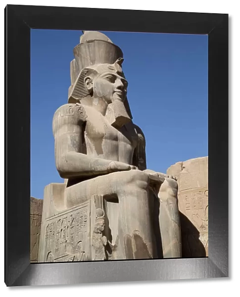 Statue of seated Ramses II, Court of Ramses II, Luxor Temple, Luxor, Thebes, UNESCO