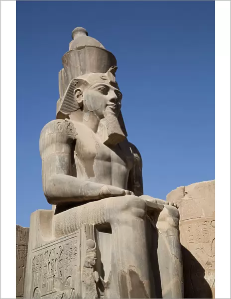 Statue of seated Ramses II, Court of Ramses II, Luxor Temple, Luxor, Thebes, UNESCO