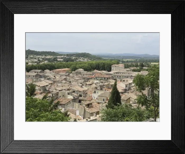 Framed Print : Houses with terracotta roof tiles in the medieval old town of Sommieres, Gard, Languedoc-Roussillon Framed Print : Houses with terracotta roof tiles in the medieval old town of Sommieres, Gard, Languedoc-Roussillon