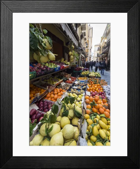 Framed Print : Fruit, including local lemons and oranges, displayed outside a shop in a narrow street Framed Print : Fruit, including local lemons and oranges, displayed outside a shop in a narrow street