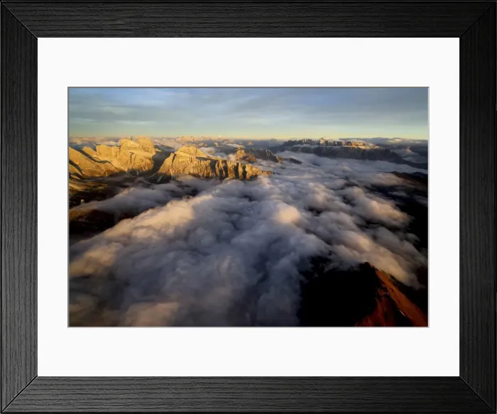 Framed Print : Aerial shot of Sella Group Alps surrounded by clouds at sunset in the Dolomites, Val Funes Framed Print : Aerial shot of Sella Group Alps surrounded by clouds at sunset in the Dolomites, Val Funes