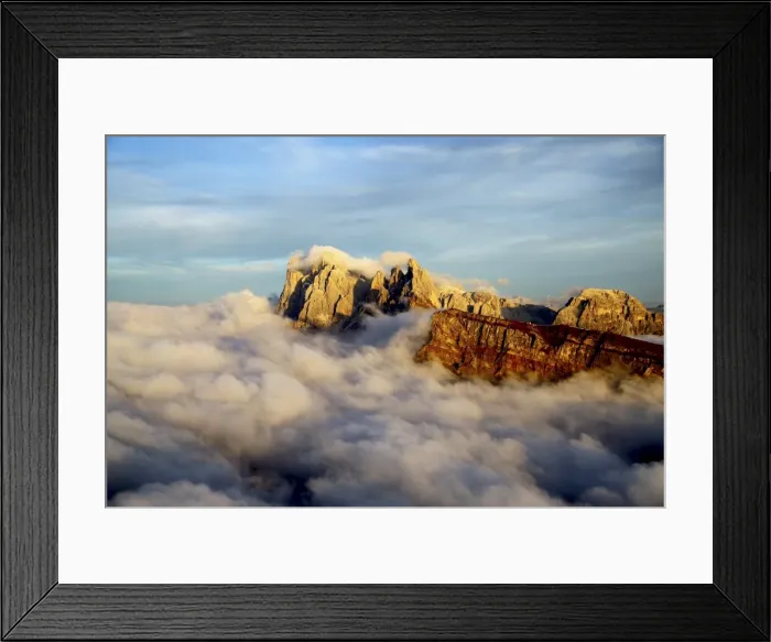 Framed Print : Aerial shot from Seceda of Odle surrounded by clouds at sunset in the Dolomites, Val Funes Framed Print : Aerial shot from Seceda of Odle surrounded by clouds at sunset in the Dolomites, Val Funes