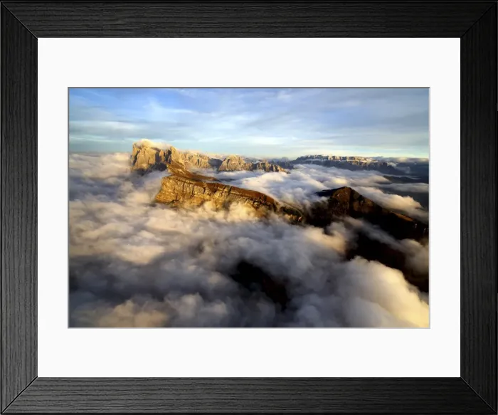 Framed Print : Aerial shot from Seceda of Odle surrounded by clouds at sunset in the Dolomites, Val Funes Framed Print : Aerial shot from Seceda of Odle surrounded by clouds at sunset in the Dolomites, Val Funes