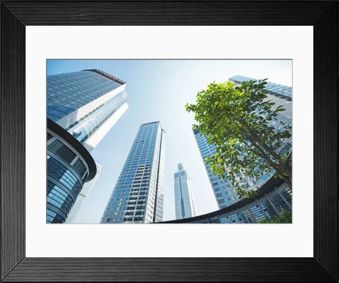 Framed Print : Low wide angle view of a group of new skyscrapers combined with fresh greenery in Jianggan