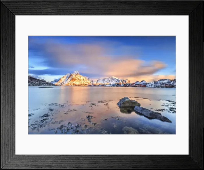 Framed Print : The pink sky at sunrise illuminates Reine village with its cold sea and snowy peaks Framed Print : The pink sky at sunrise illuminates Reine village with its cold sea and snowy peaks